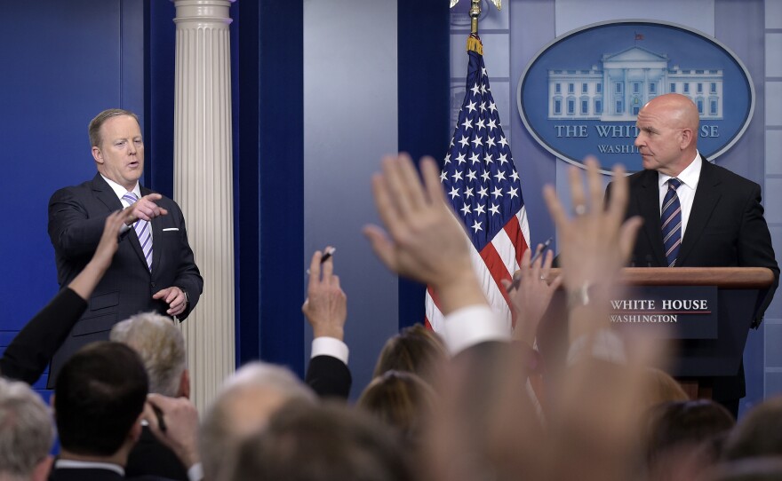 White House press secretary Sean Spicer, left, calls on a reporter as national security adviser H.R. McMaster listens at right during a briefing at the White House Tuesday.