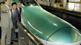 California Gov. Arnold Schwarzenegger (left) inspects Japan's high-speed-train operations in Saitama, as his home state looks to modernize its rail system. California is among the states that received $8 billion in stimulus money for high-speed rail.