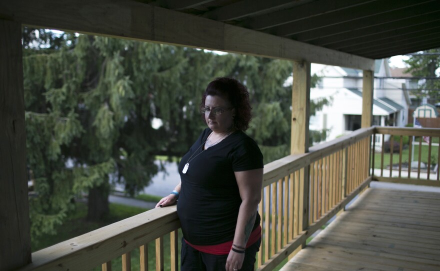 Kelly Clixby stands outside of her home in Marion. Kelly is a recovering addict who was been clean since last October.