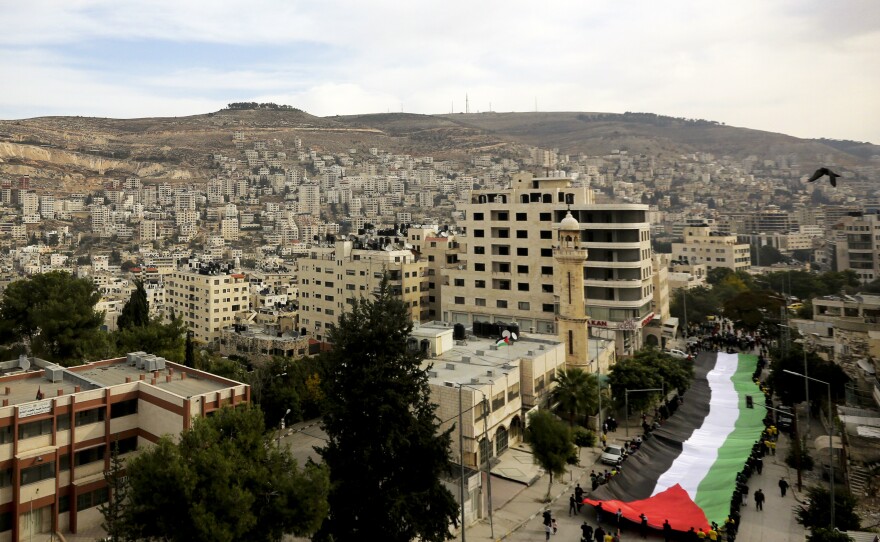 The Palestinians held rallies last November, like this one in the West Bank city of Nablus, to mark the 10th anniversary of the 2004 death of Yasser Arafat. Palestinians are increasingly frustrated with the two decades of on-and-off peace talks that have not led to an independent Palestinian state.