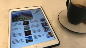 News headlines are shown on an iPad. Nov. 3, 2020.