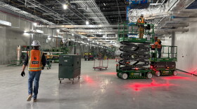 Workers continue construction on one of four main data center buildings at the Project Lighthouse complex in Port Washington, Wis. Thousands of contractors are working on the facility, bringing revenue to local businesses and traffic to city roads.