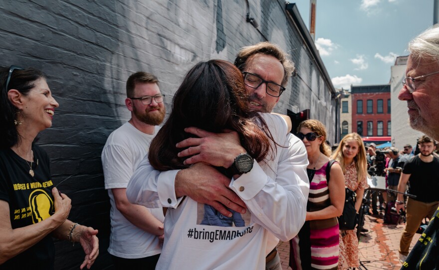 Roger Carstens, special presidential envoy for hostage affairs, embraces families and friends of Americans who are wrongfully detained during an event in Washington, D.C., on July 20.