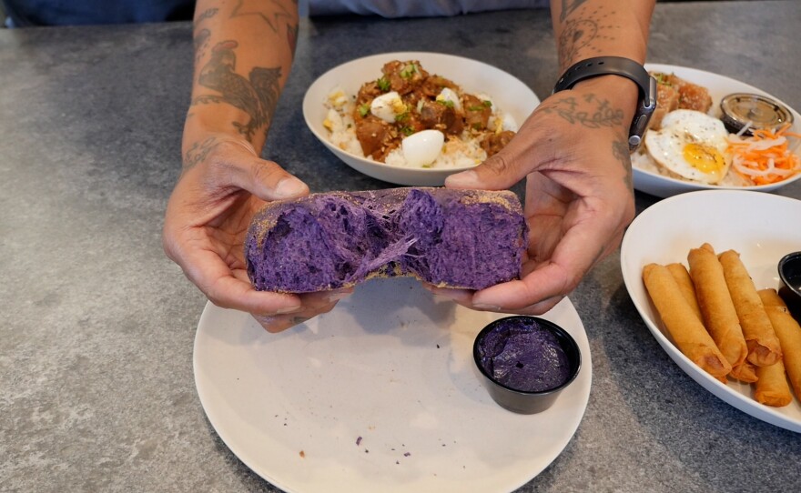 Chef Phillip Esteban pulls apart some of his ube pandesal bread at his White Rice Bodega restaurant in Normal Heights on Aug. 27, 2024, San Diego, Calif.