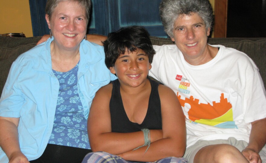 Nancy Matthews (left) and Lisa Frohman (right) traveled out of state to adopt their son, Eli. They say the new Illinois  civil union law will make it easier for gay and lesbian couples who  don't want to hide their sexuality as they try to adopt.