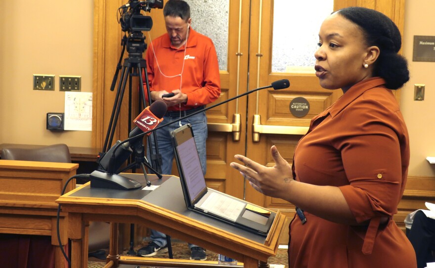Michele Watley, founder of Shirley's Kitchen Cabinet, testifies in favor of a bill before the Kansas Legislature to ban discrimination based on hairstyles in employment, housing and public accommodations during a committee hearing, Tuesday, Jan. 28, 2020, at the Statehouse in Topeka, Kan.