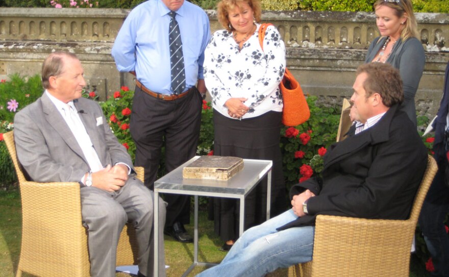 Specialist Paul Viney examines a painting box which might have belonged to John Constable.