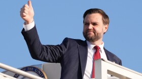 Vice President JD Vance gives a thumb up sign as he boards Air Force Two after attending talks on Iran in Islamabad, Pakistan, Sunday, April 12, 2026.