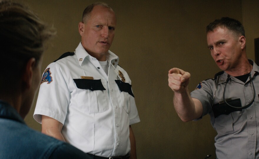 Mildred (Frances McDormand) challenges Chief Willoughby (Woody Harrelson) and Deputy Dixon (Sam Rockwell) about the progress or lack of progress in her daughter's murder case in "Three Billboards Outside Ebbing, Missouri."