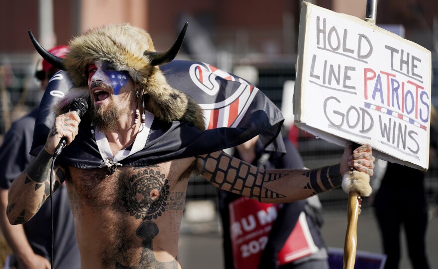 PHOENIX: Jake Angeli, a supporter of President Donald Trump, speaks at a rally outside the Maricopa County Recorder's Office Saturday, Nov. 7, 2020, in Phoenix.