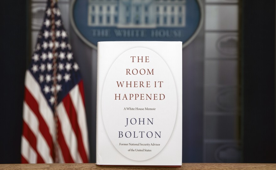 A copy of John Bolton's new book, The Room Where It Happened, stands in the White House briefing room. On Saturday, a federal judge declined the Trump administration's request to block the publication of the former national security adviser's book.