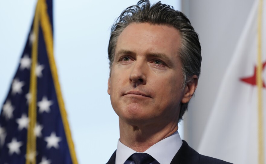 Gov. Gavin Newsom, pictured on Monday, says California has reduced a backlog of testing. The state is asking for contributions of medical supplies with a new website.