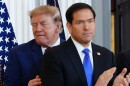 President Donald Trump walks past Secretary of State Marco Rubio as he arrives for a roundtable on the American mining industry, Friday, Aug. 7, 2026, at the State Department in Washington.