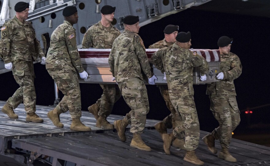 The remains of Staff Sgt. Dustin Wright are transferred at Dover Air Force Base, Del., in October. Wright and three other American soldiers were killed in an ambush in Niger.