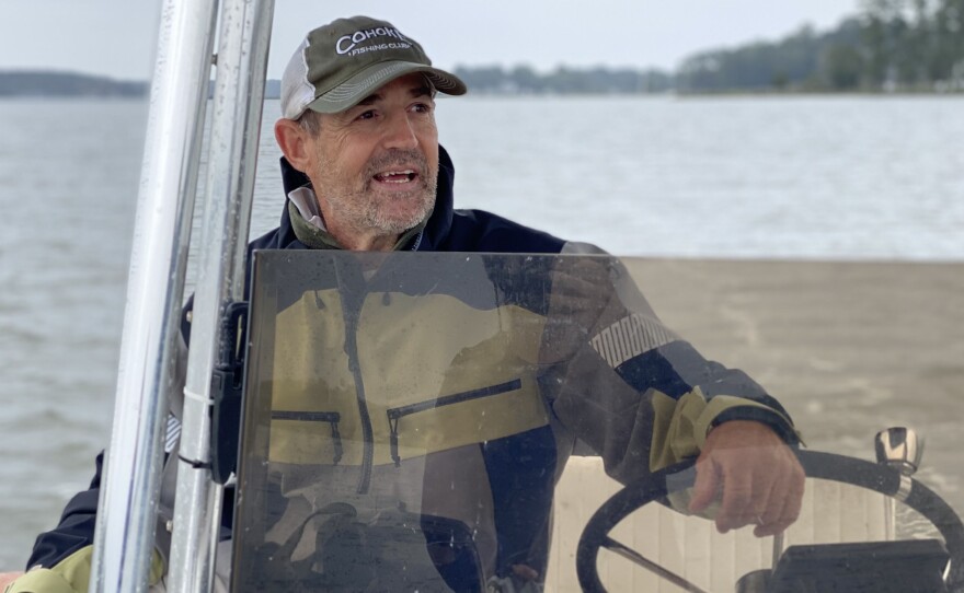Chris Dollar steers his boat on the Ware River in Gloucester, Virginia in September. A charter fishing captain and conservation advocate, Dollar said he sees fewer fish in the bay and its tributaries than he used to. Schools of menhaden that used to be "the size of a football field" have shrunk to "maybe a tennis court," he said.