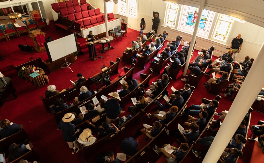 Students from the Franchell Boswell Educational Foundation listen to a Juneteenth presentation at Avenue L Baptist Church.
