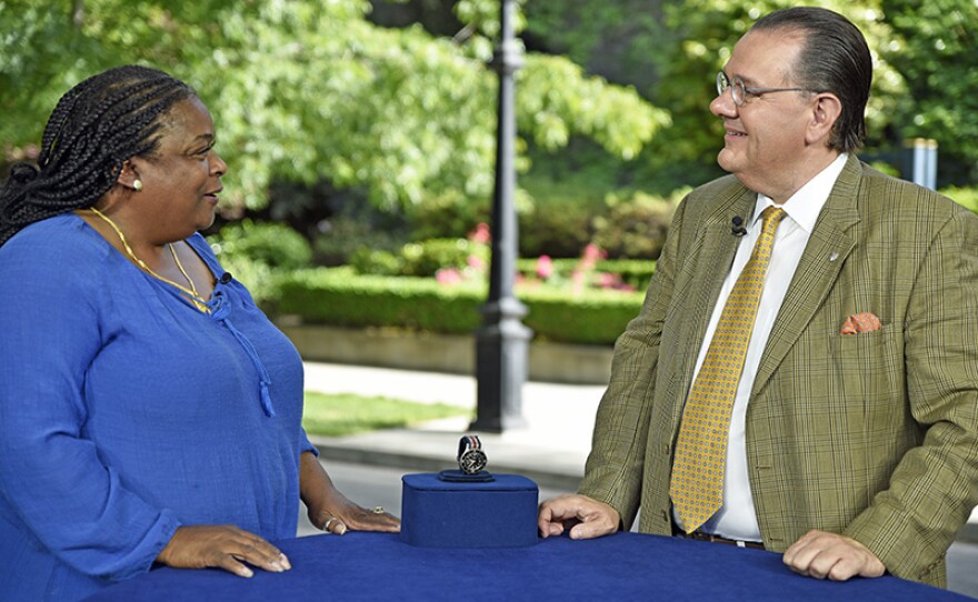 Peter Planes (right) appraises a Blancpain "Aqua-Lung" diver's watch, ca. 1961 at Crocker Art Museum.
