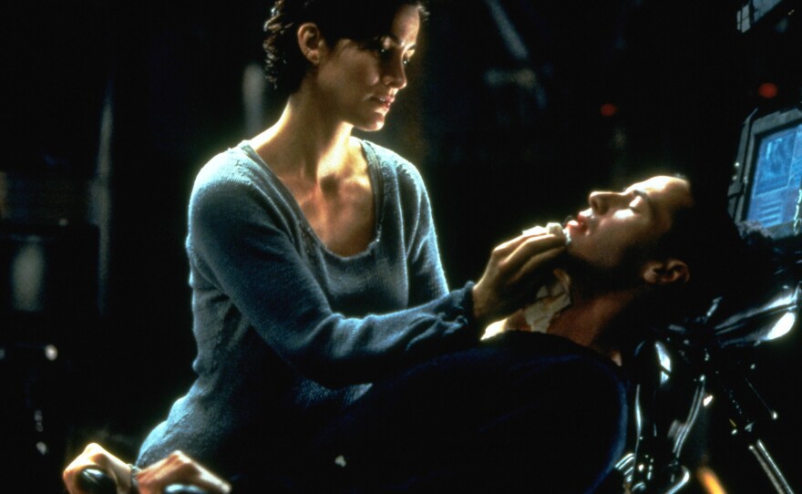 Carrie-Anne Moss and Keanu Reeves in The Matrix