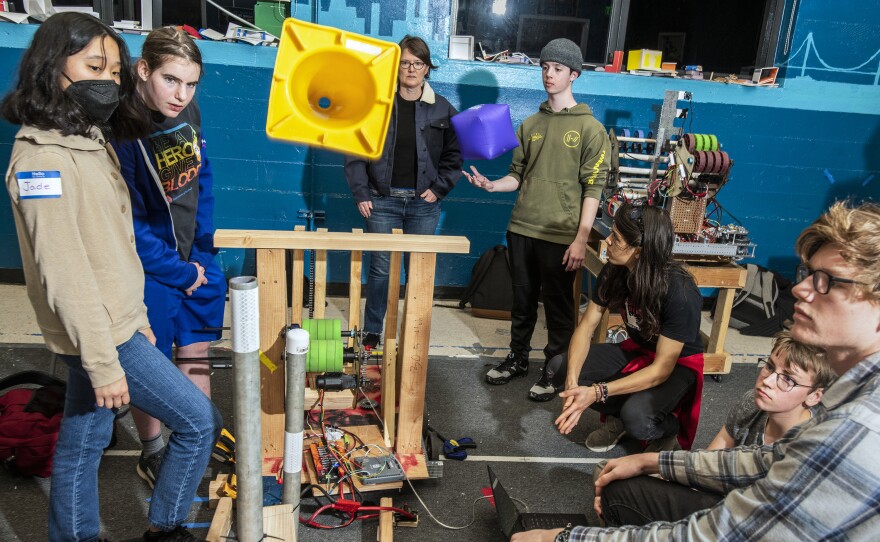 Team 5419 Berkelium team members, from Berkeley High School in Berkeley, Calif., test a prototype system to shoot cones onto poles. Caroline Soffer (second from left), 16, is a competitive gymnast and a designer. "I'm never going to be a pro gymnast, while there's a very, very good chance that I'm going to end up in engineering or computer science," she says.