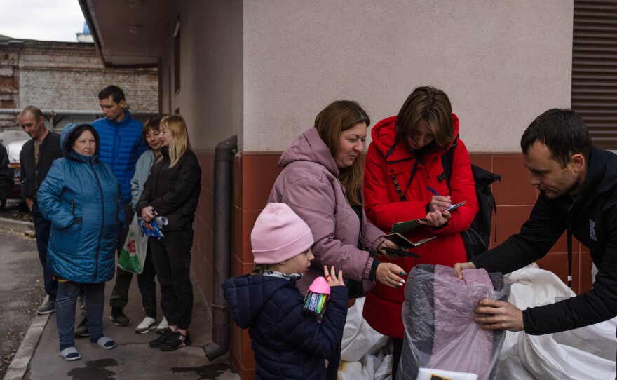 The International Rescue Committee hands out blankets and other winter gear to people in need in Dnipro, Ukraine, in October.