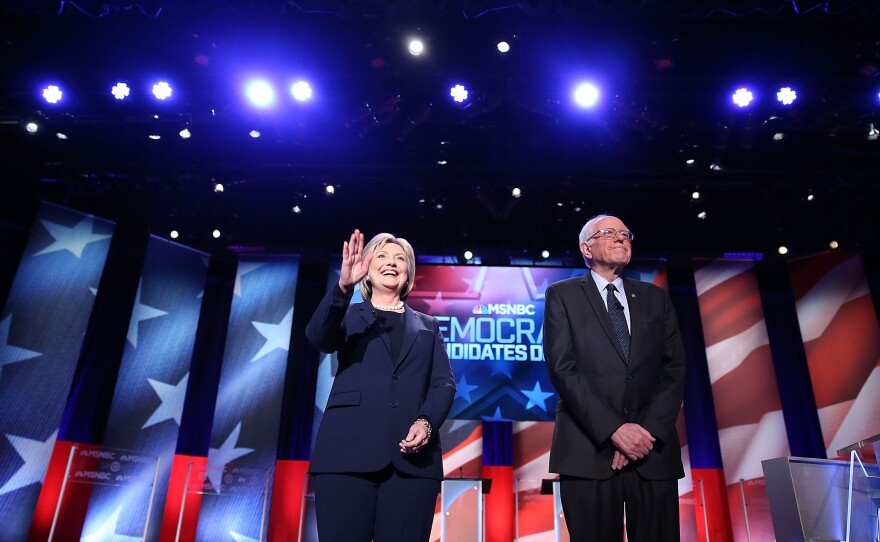 Democratic presidential candidate former Secretary of State Hillary Clinton and U.S. Sen. Bernie Sanders, I-Vt., stand next to each before their debate in Durham, N.H. The debate was sponsored by MSNBC.