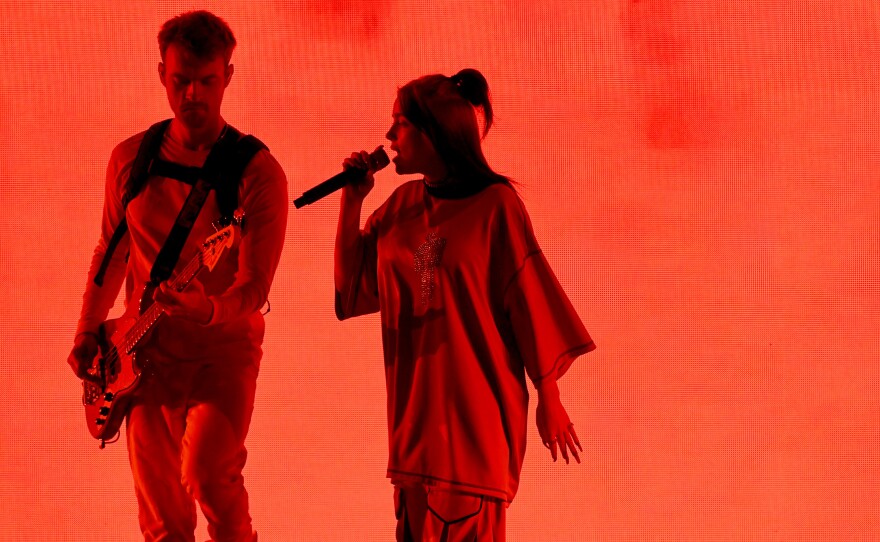 Billie Eilish (right) performs with her brother, Finneas O'Connell in Los Angeles in October. The pair write all of Eilish's music together and O'Connell produces it.