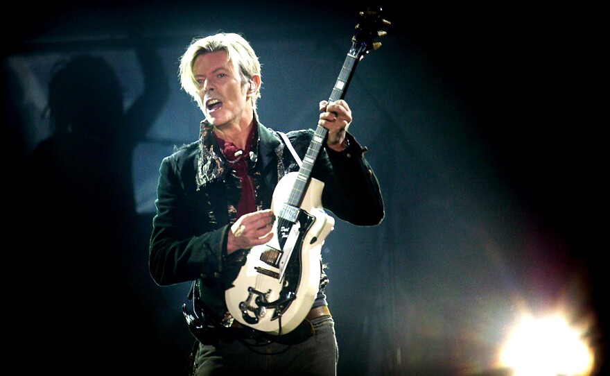 Bowie performs on stage at the Forum in Copenhagen in 2003.