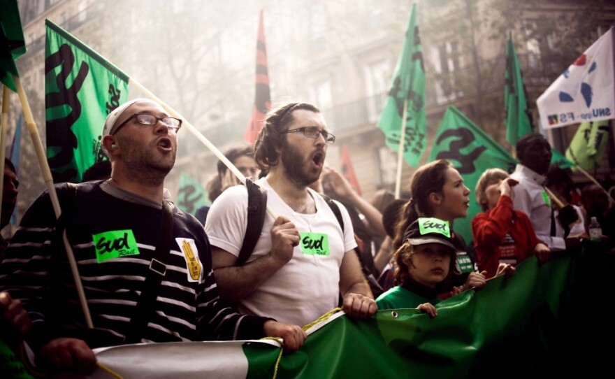 Tens of thousands of people in Paris used the annual May Day workers' events this year to denounce the world of finance amid the Europe-wide debt crisis. If elected, France's Socialist presidential challenger, Francois Hollande, says he will pursue a growth-oriented strategy.