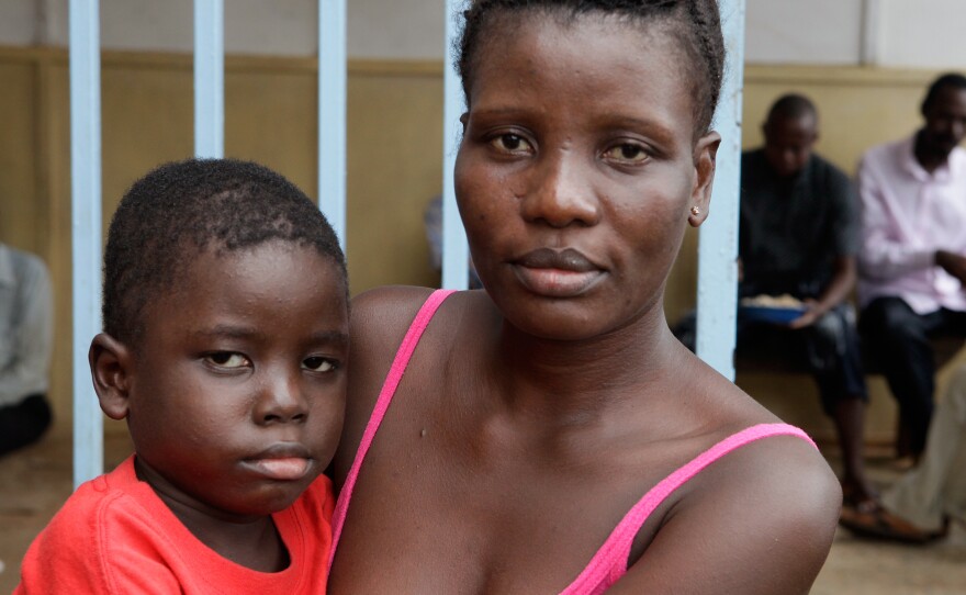 Jusoisatu Jusu and her son, Sam, are among the 30-some survivors living in the old Lassa Fever ward at Kenema Hospital.