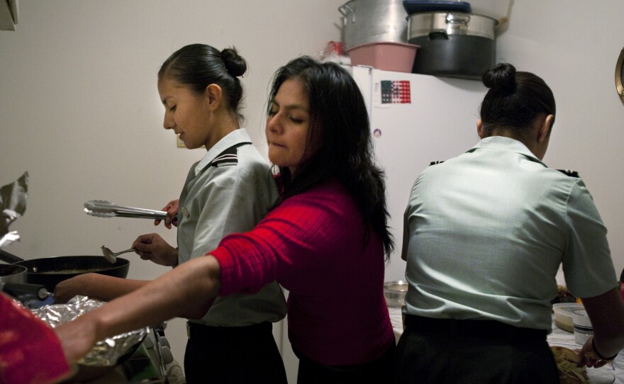 Dinner is family time for Sandra (center) and her daughters Isle (left) and Carina Montes. The family relocated to the U.S. from Mexico when Carina was 2 and Isle was just 5 months old. The girls have been in the Phoenix school system since kindergarten — and are two of an estimated 1.7 million illegal youth living in the United States.