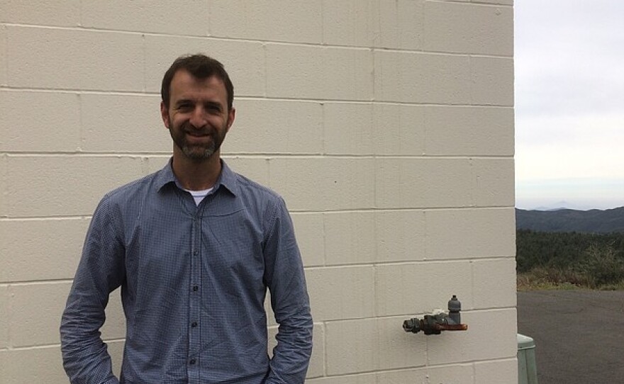 Robert Quimby stands in front of the Mount Laguna Observatory