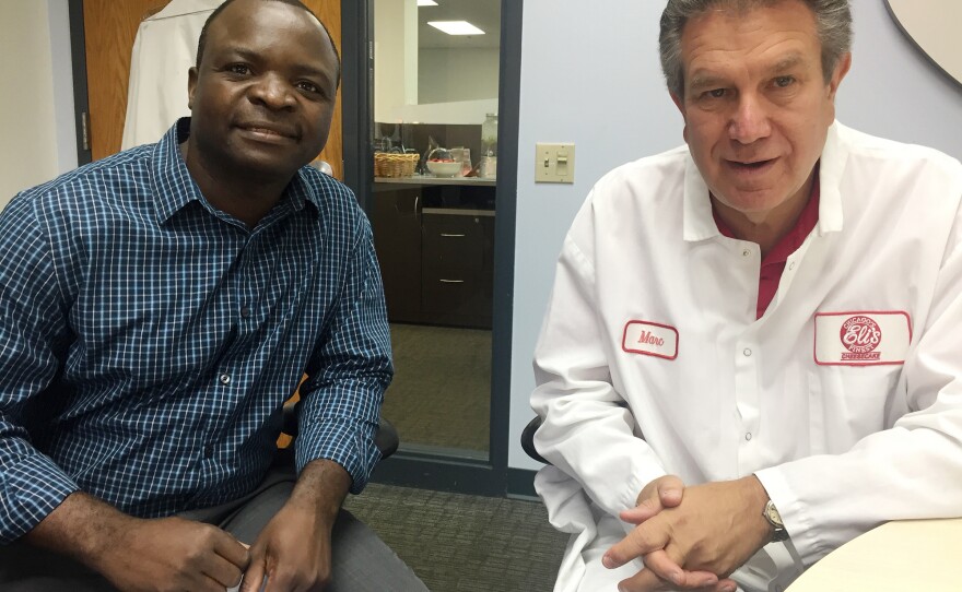 Elias Kasongo came as a refugee in 1994. Marc Schulman, president of Eli's Cheesecake, hired him to wash cake pans and, over the years, promoted him to purchasing manager.