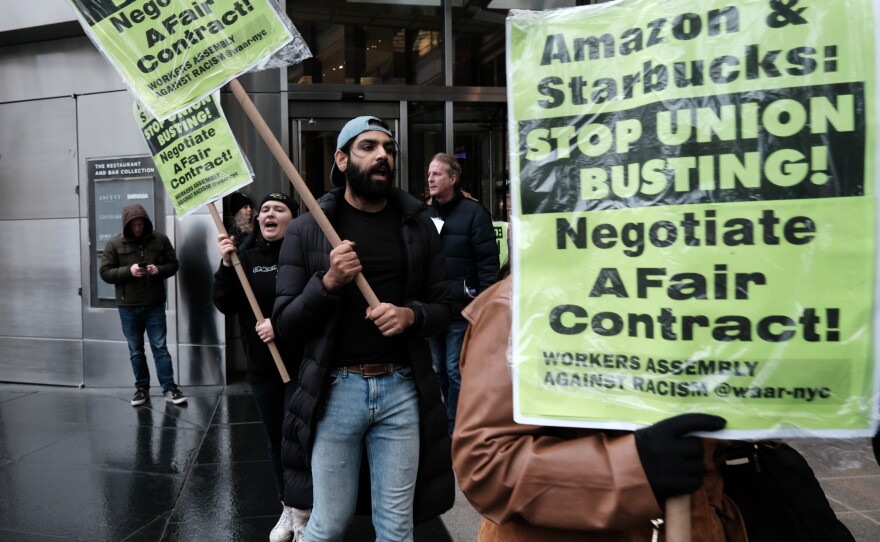 Members of the Amazon Labor Union and others protest outside the New York Times DealBook Summit on Nov. 30, 2022, as Amazon CEO Andy Jassy is scheduled to speak.