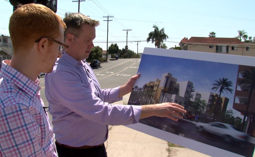 Dave Gatzke of Community Housing Works holds an artist's rendering of the LGBT-affirming North Park Seniors affordable housing development, June 22, 2016.