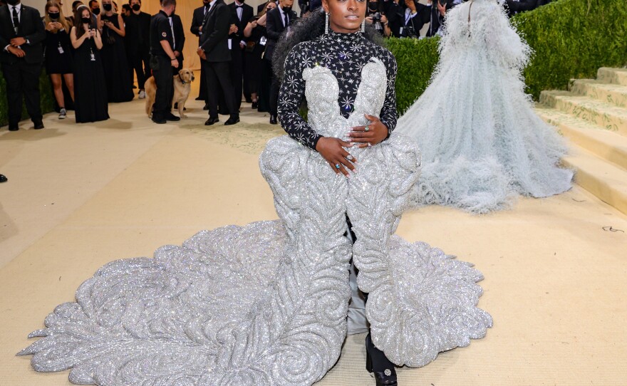 Simone Biles wears an Area showgirl dress.