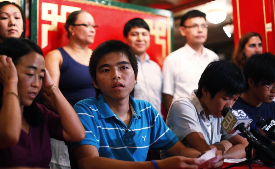 Duong Nghe Ly, center, at a news conference in 2011, in which Asian and community leaders discussed a U.S. Department of Justice investigation into a series of racial attacks, in Philadelphia.