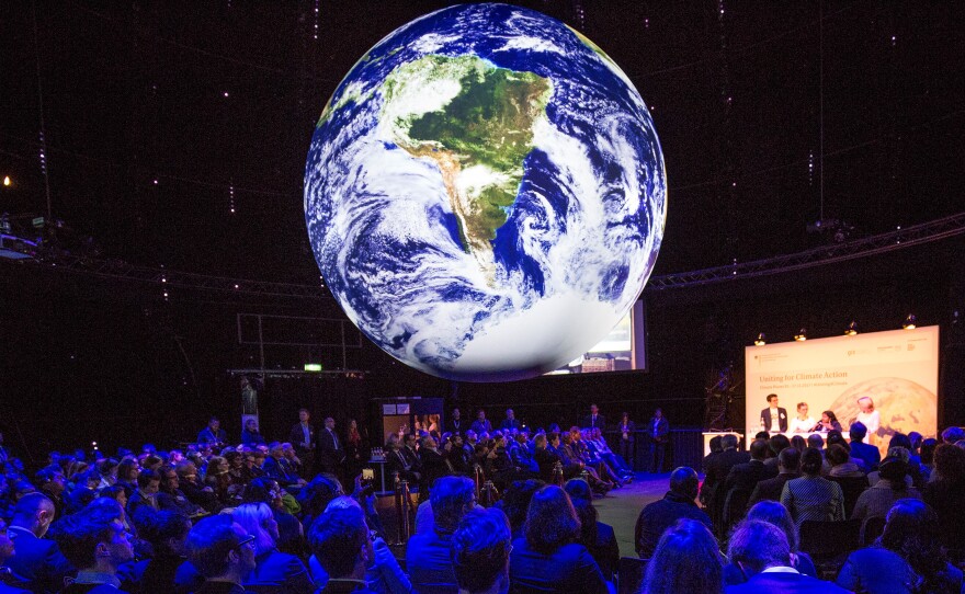 Climate conference attendees in Bonn, Germany, see a representation of Earth's climate trends.