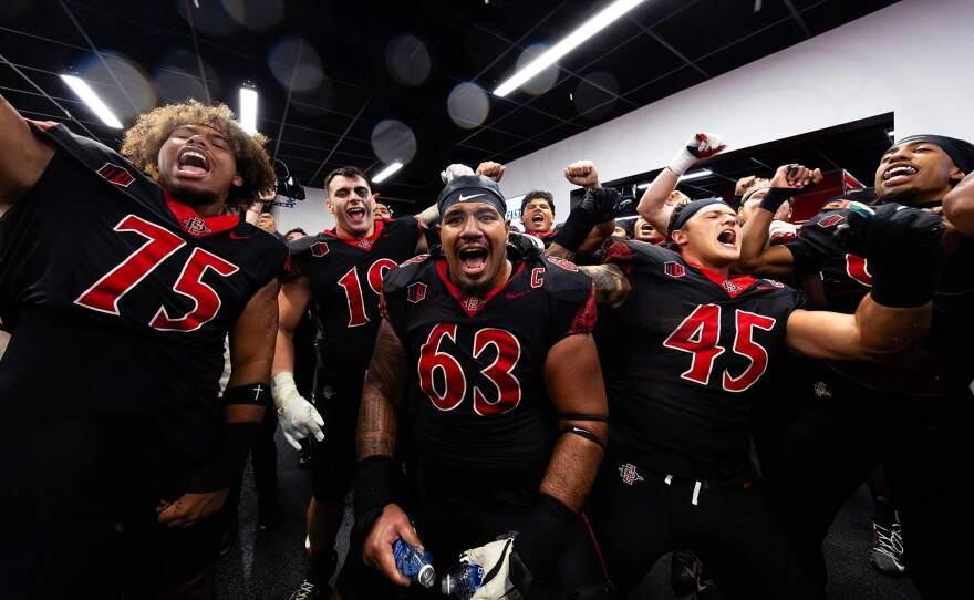 San Diego State University football players celebrate in this undated photo.