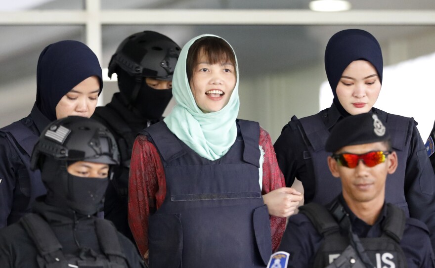 Doan Thi Huong (center) leaves the court in Shah Alam, Malaysia, on Monday. Prosecutors have dropped murder charges against her.