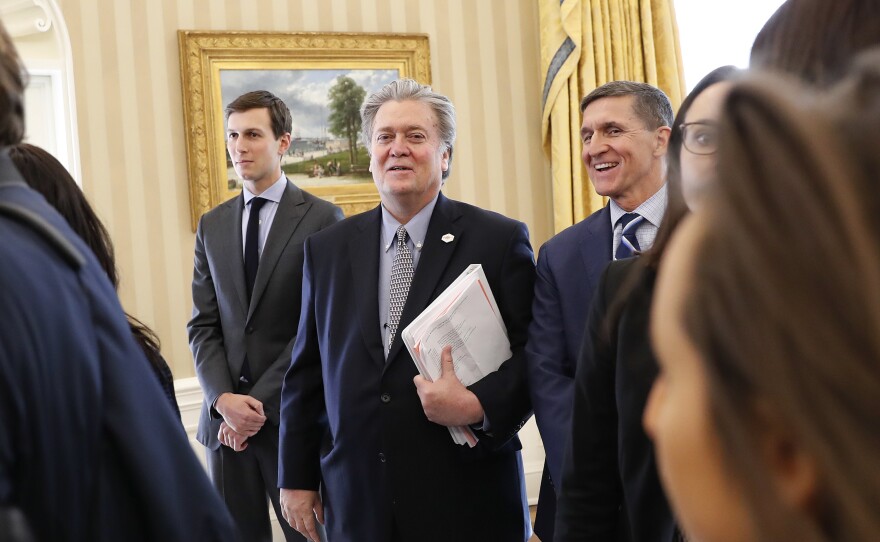 White House senior advisers Jared Kushner (from left), Steve Bannon and national security adviser Michael Flynn are seen in the Oval Office of the White House in Washington on Friday.