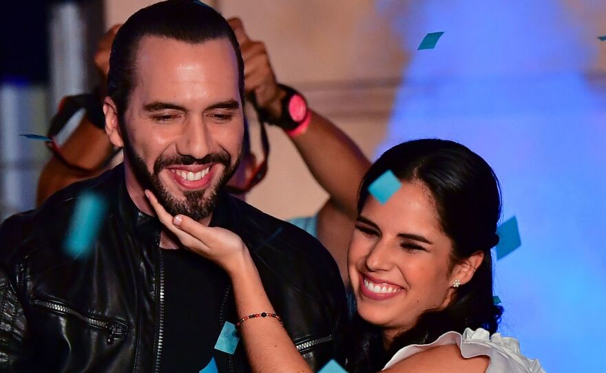 Nayib Bukele, celebrating with his wife, Gabriela Rodríguez de Bukele, was declared the winner of El Salvador's presidential election Sunday night.