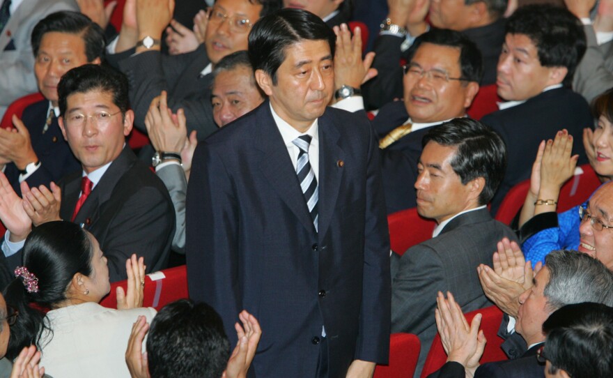 Shinzo Abe acknowledges applause from Liberal Democratic Party lawmakers as he wins Japan's ruling party's presidential vote, Sept. 20, 2006, in Tokyo.