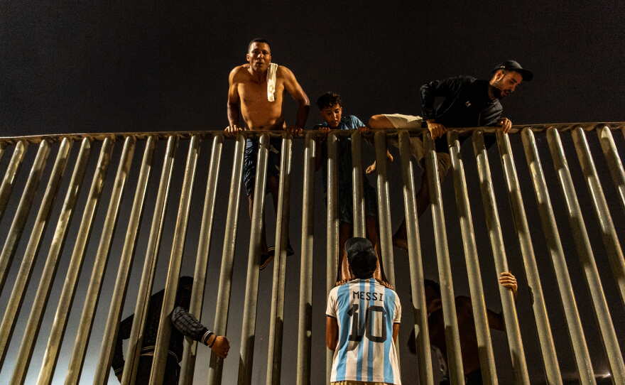 Migrants try to cross from Morocco into the Spanish enclave of Ceuta, Friday, July 31, 2026.