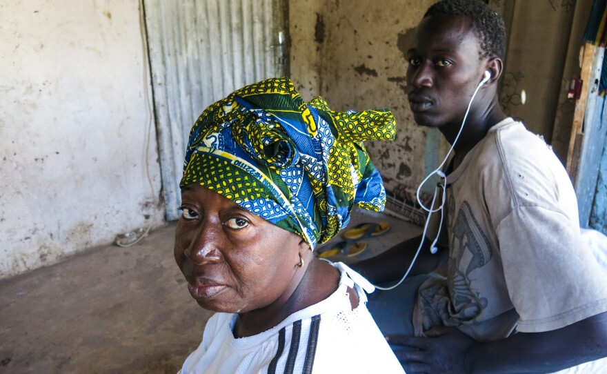 Kadiatou Cisse and her youngest son, Souleymane Sebor, who tried and failed to get to Italy.