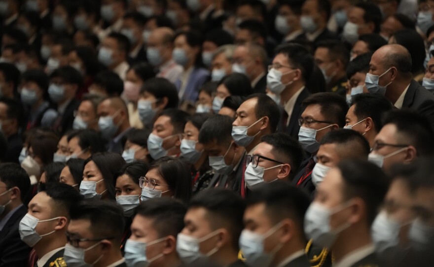 Delegates wearing masks attend the opening ceremony of the 20th National Congress of China's ruling Communist Party.