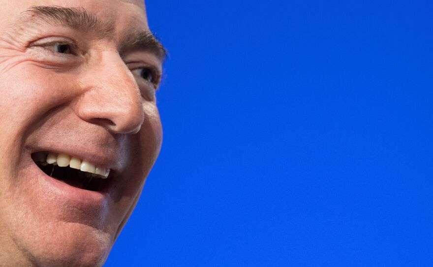 Amazon founder Jeff Bezos is the world's wealthiest person, according to the latest Bloomberg Billionaires Index, with a net worth of $186 billion. Four others also have fortunes over $100 billion. Here, Bezos speaks at a conference in 2018.