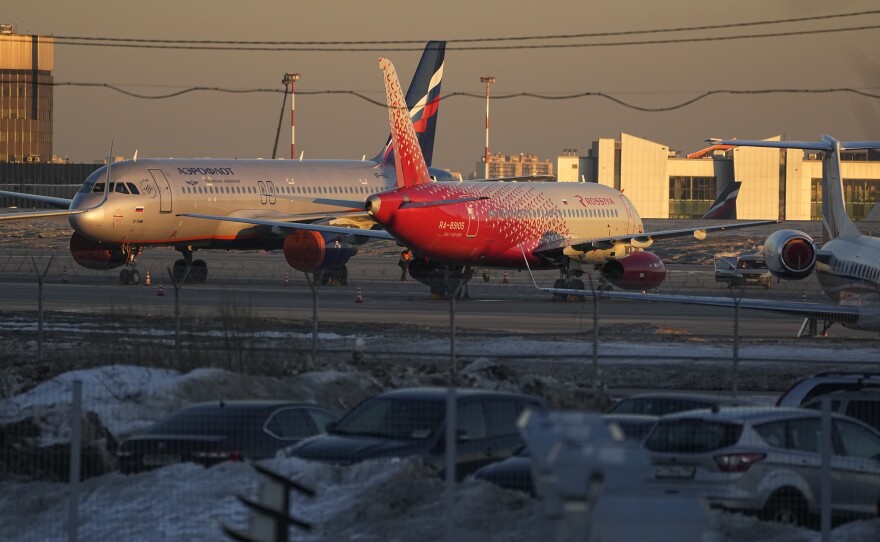 Aeroflot passengers planes are seen parked at Sheremetyevo Airport, outside Moscow, on  Tuesday. Russia's largest airline, Aeroflot, said Monday that it suspended flights to New York, Washington, Miami and Los Angeles because Canada had closed its airspace to Russian planes.