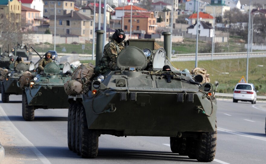 Russian armored vehicles drive on the road between Simferopol and Sevastopol in Crimea on March 17. Members of the Good Judgment Project are asked about the likelihood of world events such as Russia's the recent annexation of Crimea.
