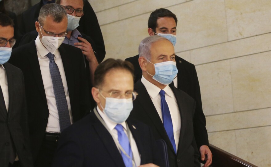 Israeli Prime Minister Benjamin Netanyahu makes his way to attend the swearing-in ceremony of his new government at the Knesset, Israel's parliament, on Sunday.
