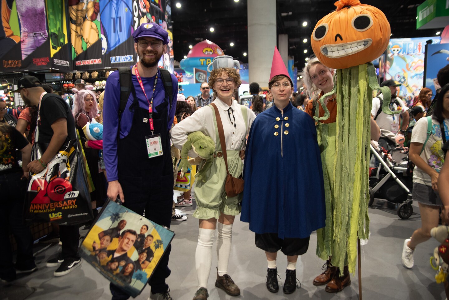 Daniel Fugett (left), Marley Wisby, Micheala Whatnall and E Southern (right) cosplay as characters from the show "Beyond the Garden Wall" on July 25, 2025.